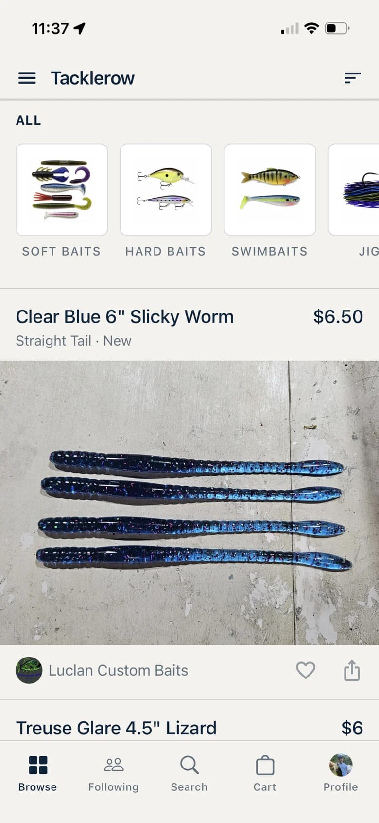 The Tacklerow browse feed on iPhone: category rail across the top, and a Clear Blue 6 inch Slicky Worm from Luclan Custom Baits listed at $6.50.